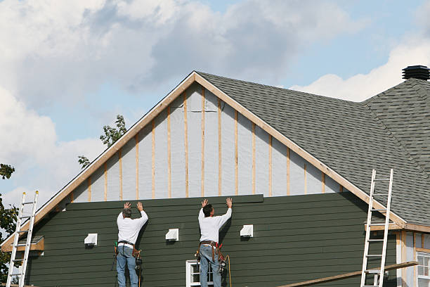 Professional Storm Damage Siding Repair technician working in Quincy, MA